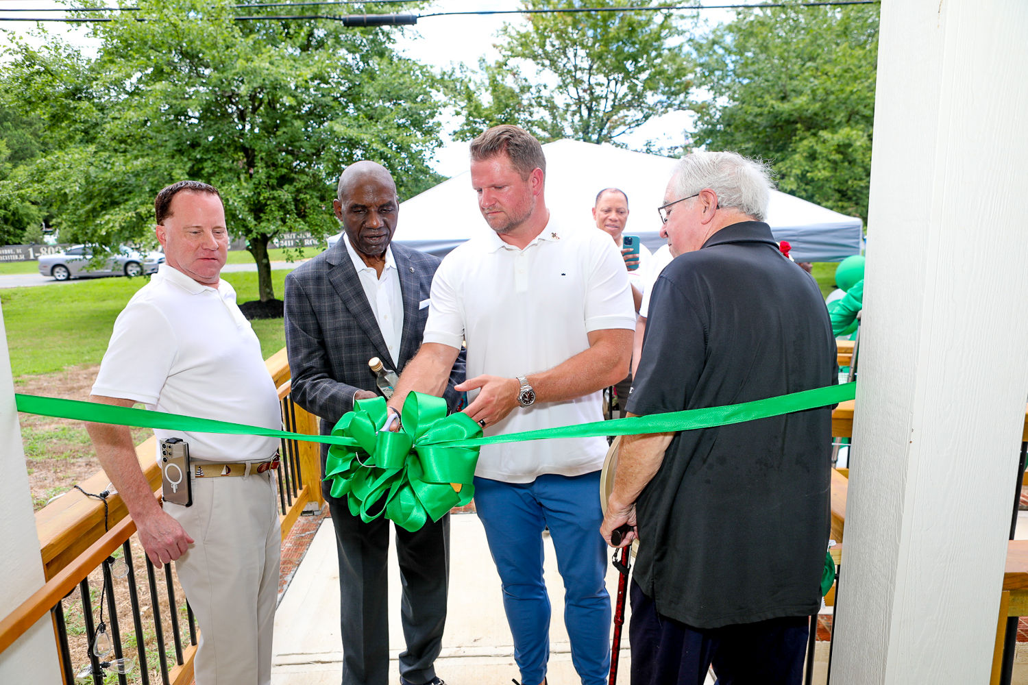 Community members and the Gracious Senior Living team gathered for a grand-opening ribbon cutting
